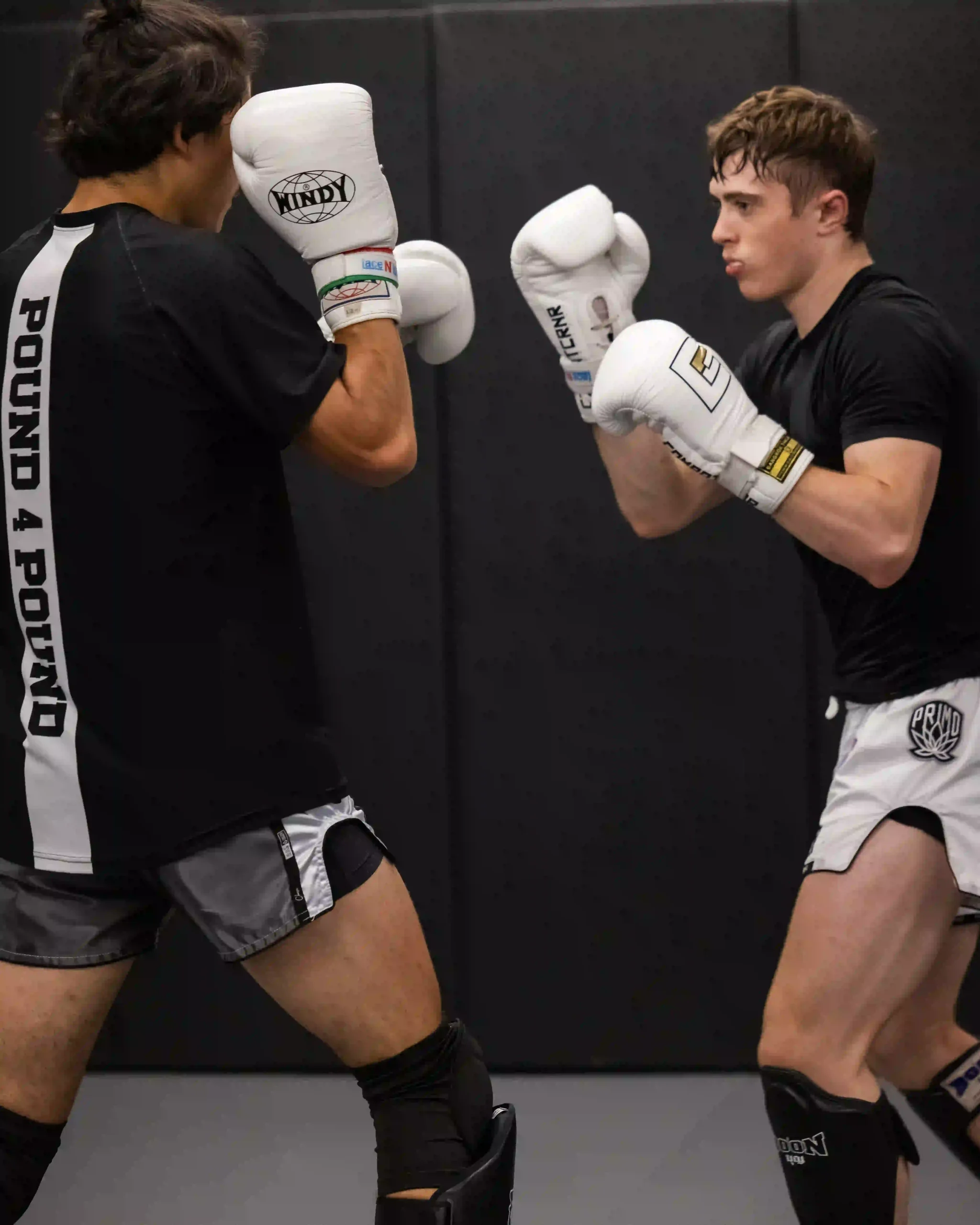 One-on-one Muay Thai pad training with a coach at Pound 4 Pound in Littleton