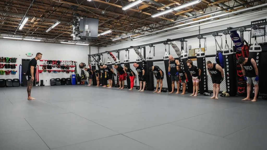 Muay Thai students practicing partner drills at Pound 4 Pound in Littleton, Colorado