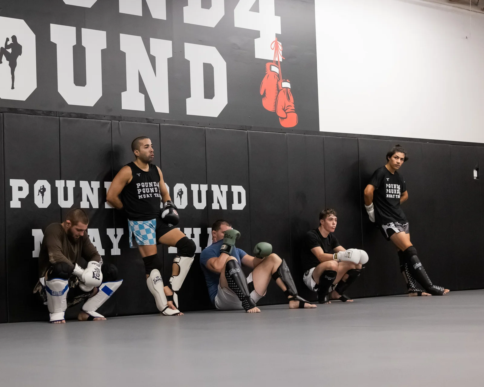 Muay Thai coach guiding pad work at Pound 4 Pound in Littleton, Colorado